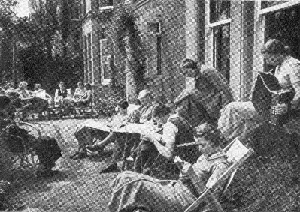 The girls relax in the college garden.