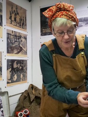 A Bexhill Museum Education Team volunteer with the WWI collection.