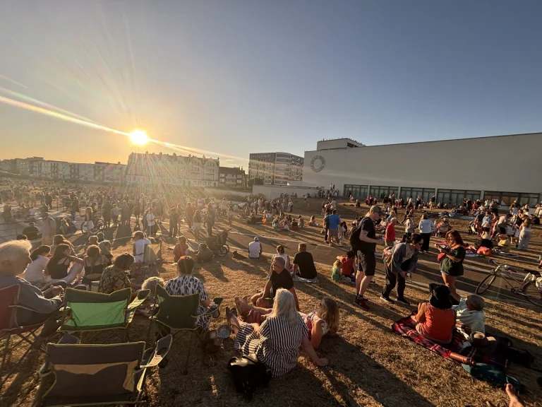 Eclipse watchers gather outside the pavilion on Wednesday.