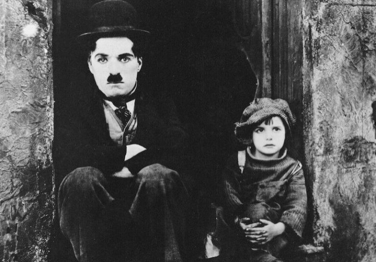 Charlie Chaplin & Jackie Coogan in a scene from The Kid. Charlie Chaplin & Jackie Coogan in a scene from The Kid.