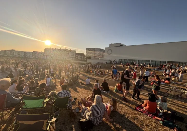 Eclipse watchers gather outside the pavilion on Wednesday.